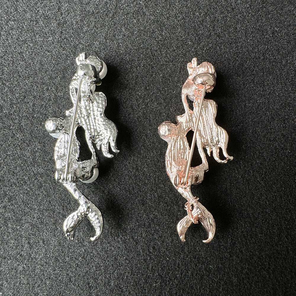 Silver alloy mermaid brooch with crystal embellishments