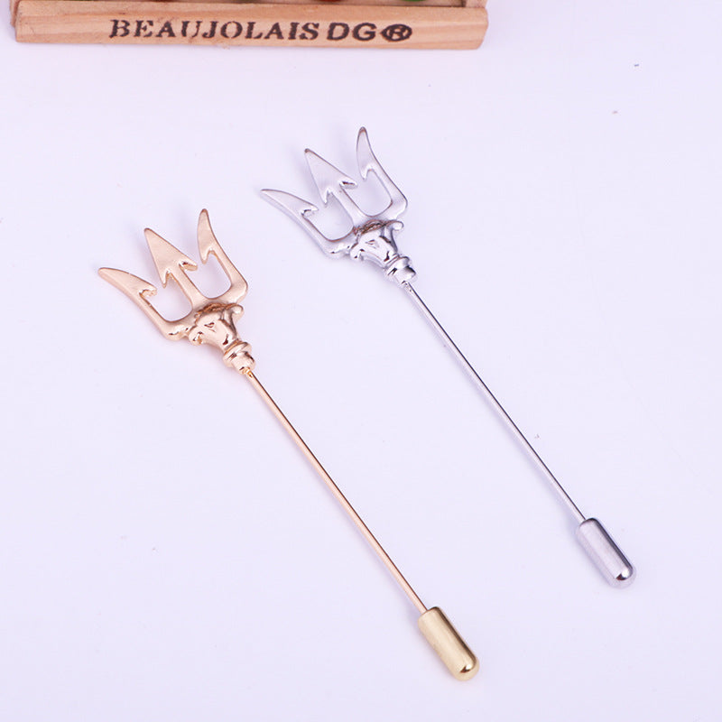 Trident brooch accessory on trendy outfit