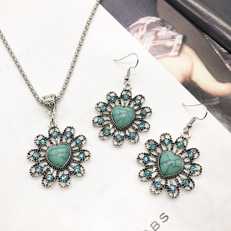 Flat lay display of necklace and earrings with turquoise details - image 6