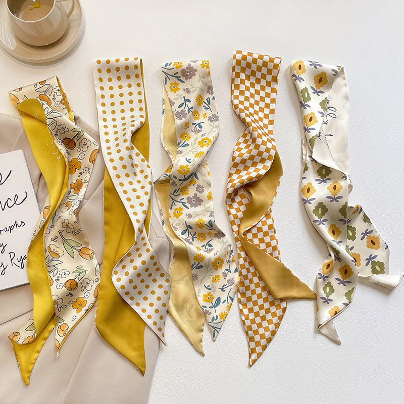 Yellow floral scarf tied to bag