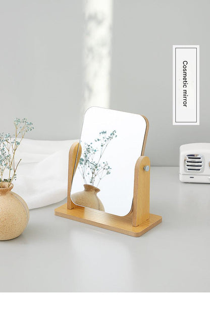 Compact wooden makeup mirror on desk