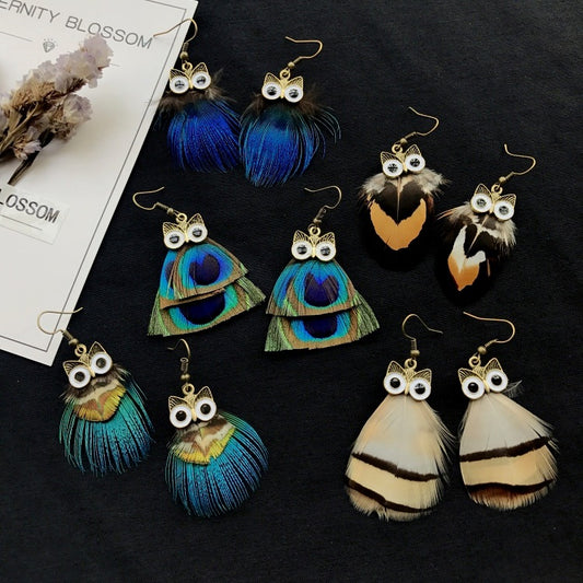 Vintage owl feather earrings close-up