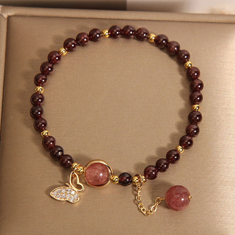 Showcasing garnet butterfly jewelry