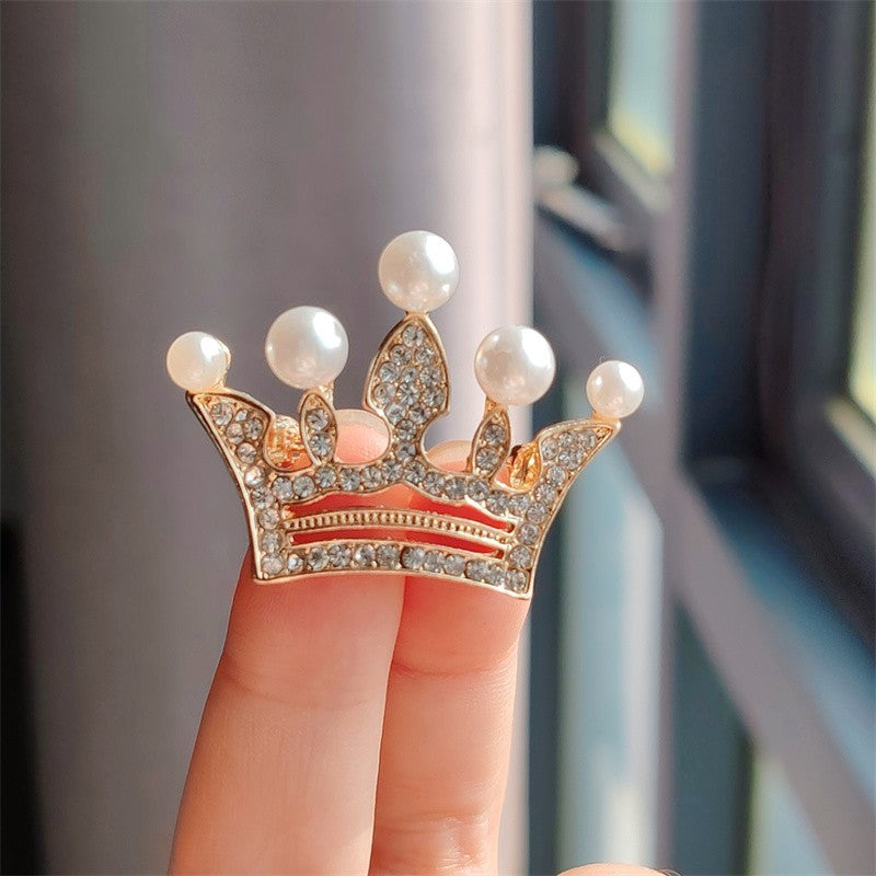 Gold crown brooch with rhinestones