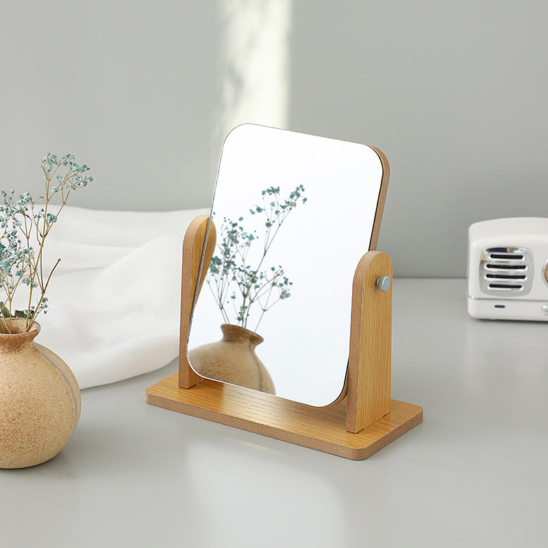 Compact wooden makeup mirror on desk