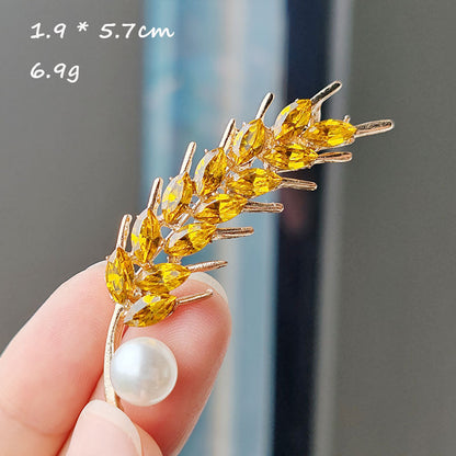 Close-up of sunflower brooch for women