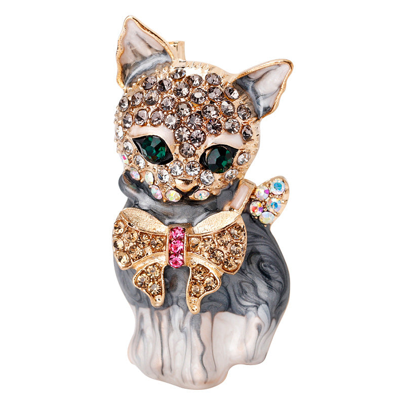 Close-up of cat brooch detailing