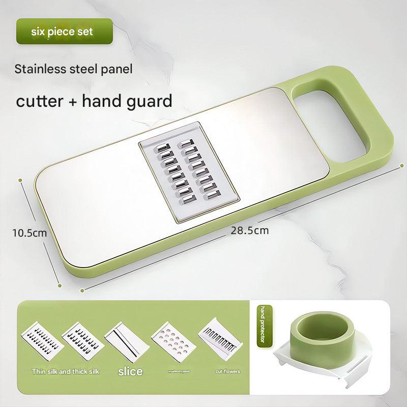 stainless steel grater next to cutting board