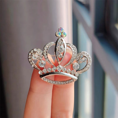 Detailed close-up of rhinestone crown pin