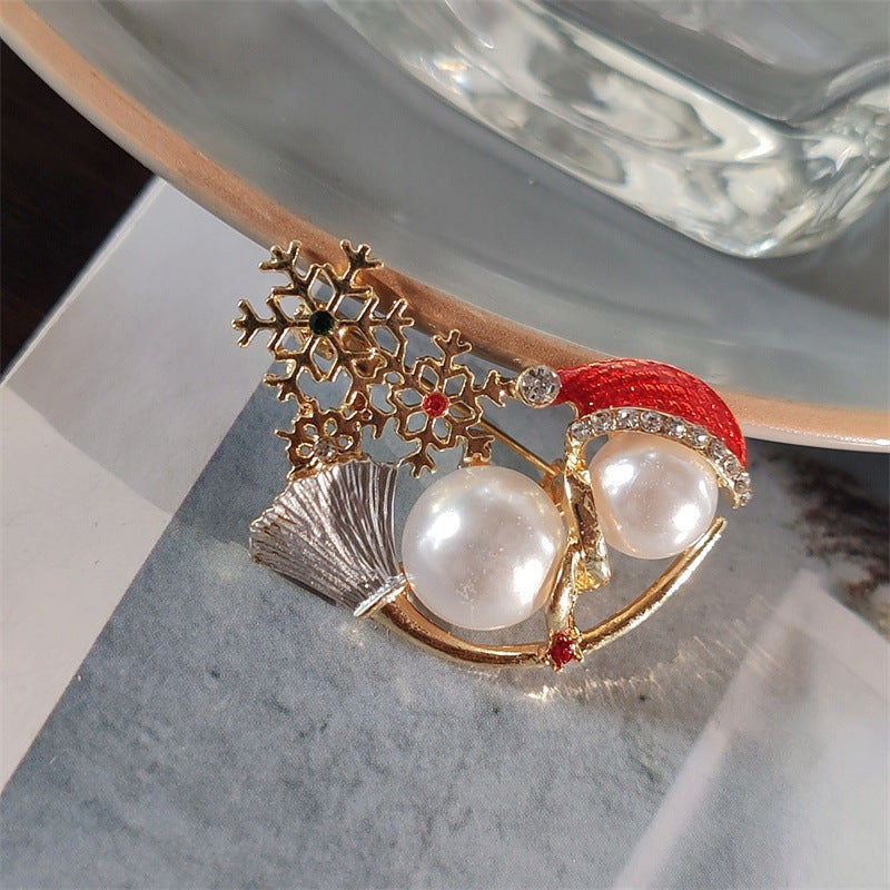 Stylish snowman brooch on sweater