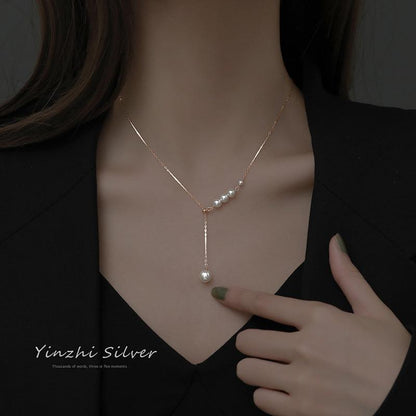 Elegant S925 silver tassel necklace on display