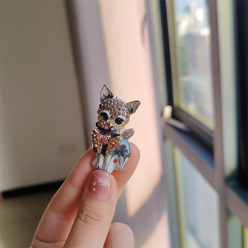 Stylish alloy cat brooch pin on white background