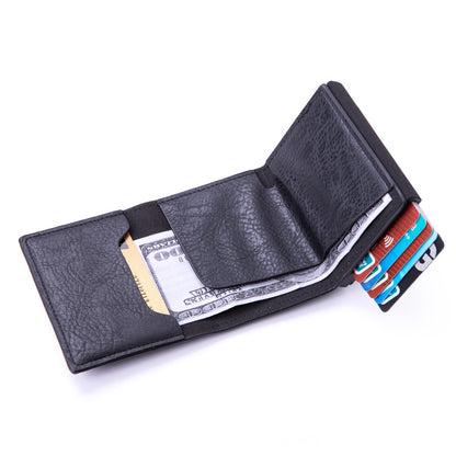Aluminum wallet in hand for size comparison