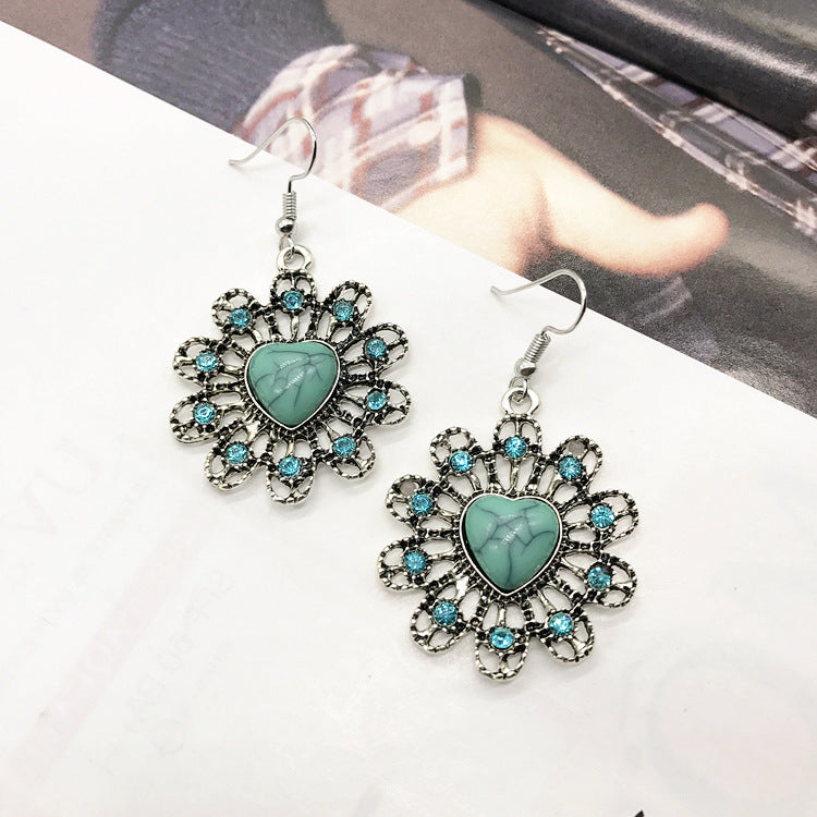 Close-up of turquoise earrings in vintage design - image 2