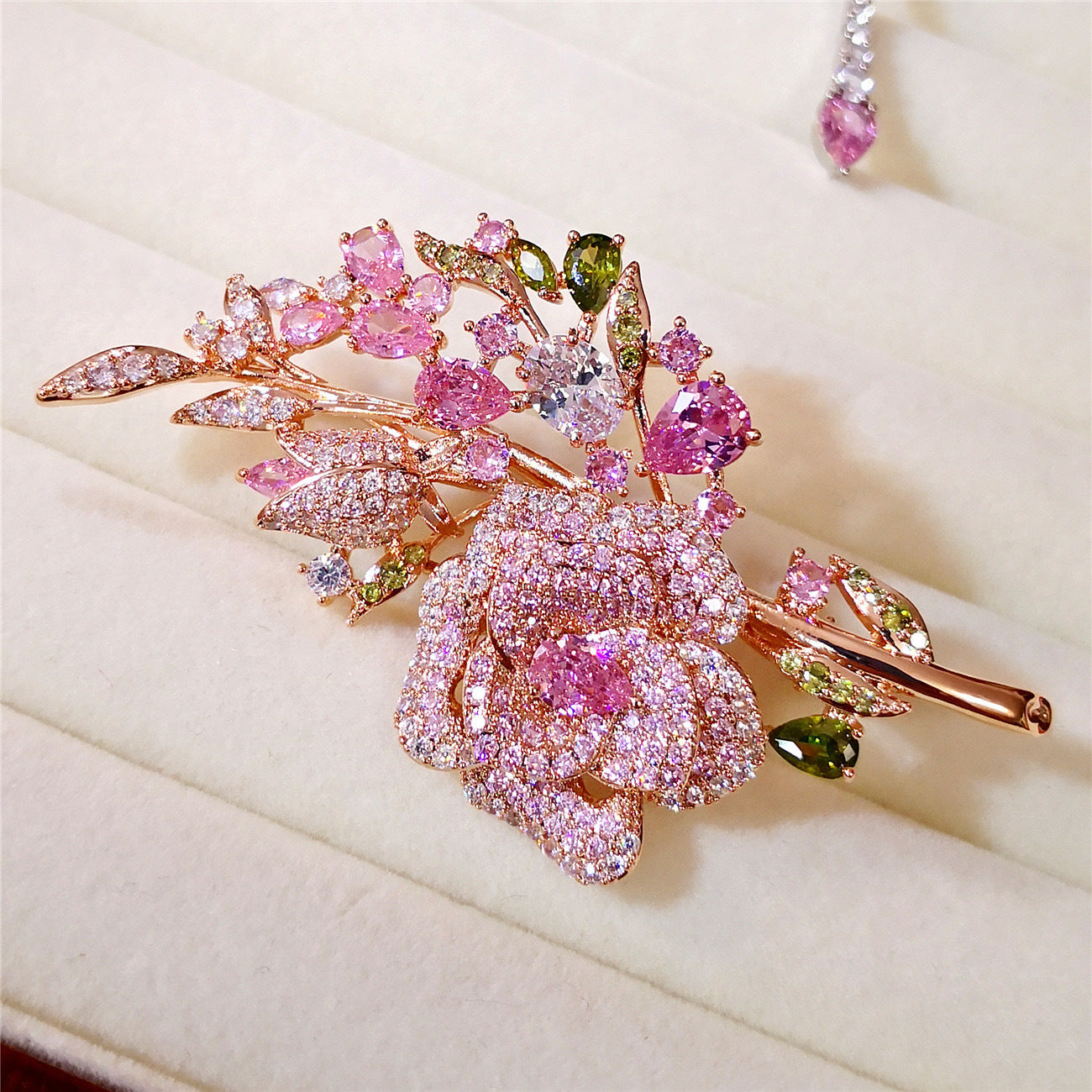 Pink rose bouquet brooch on jacket