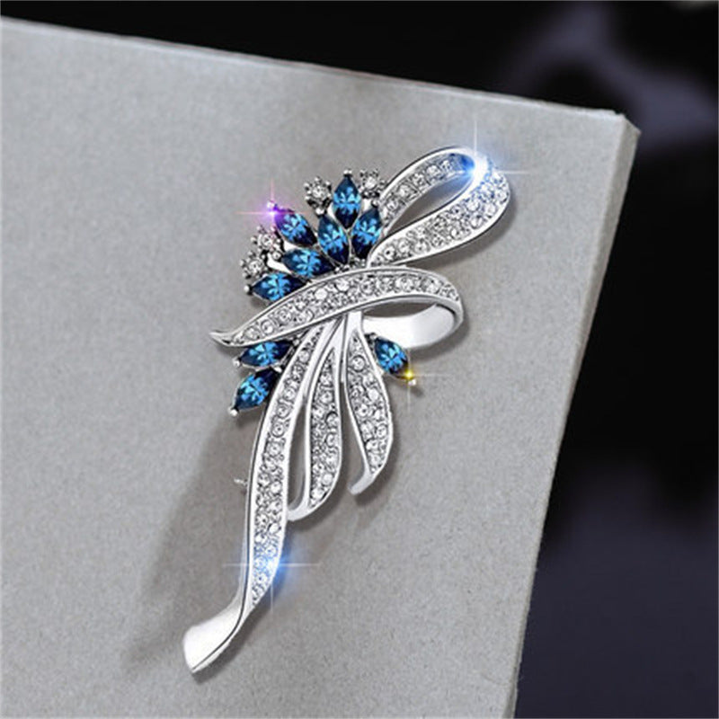 floral brooch with cat's eye stone