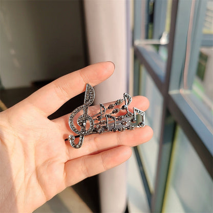 musical note brooch brown color rhinestones