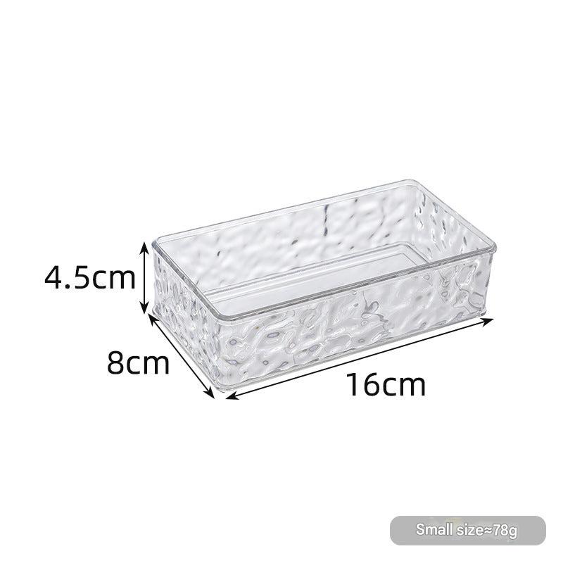 Stackable makeup storage container on a desk - image 2