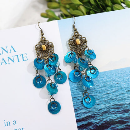 Elegant mother-of-pearl earrings on model