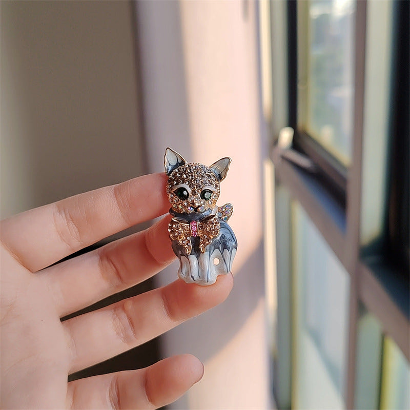 Trendy cat motif brooch on a jacket